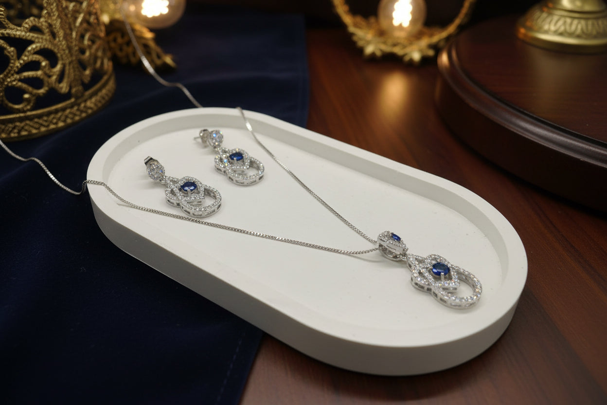 Silver blue diamond pendant and earring set.