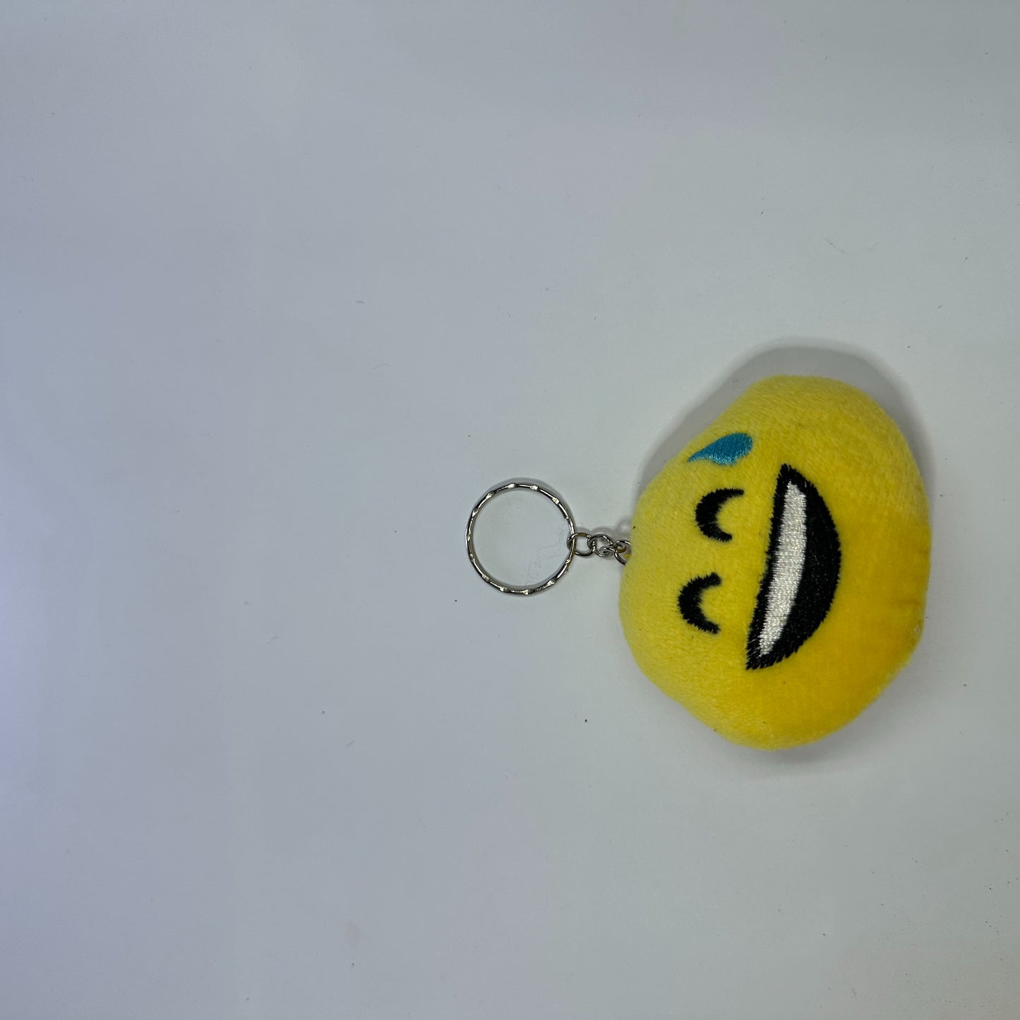 Sweat smile face fluffy keychain.
