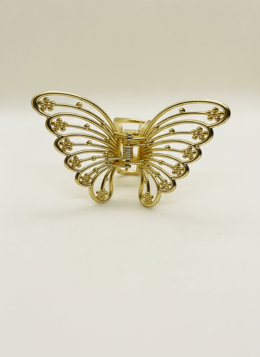 Gold metal butterfly hair claw.