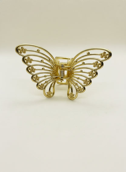 Gold metal butterfly hair claw.