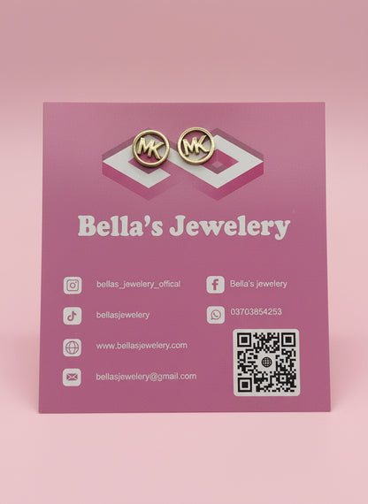 Black Or Dark-toned stud earrings with the letters "MK"