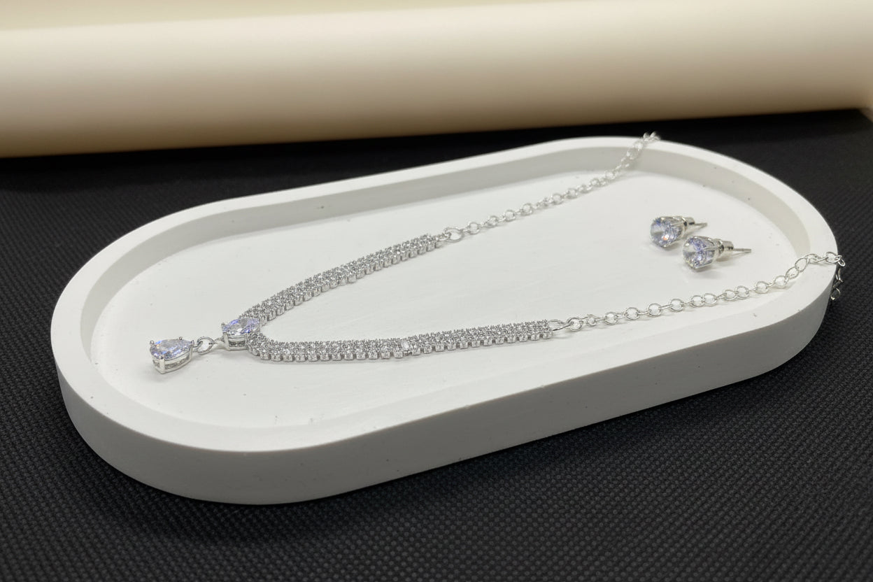 cubic zirconia baguette and pear drop necklace and earrings set