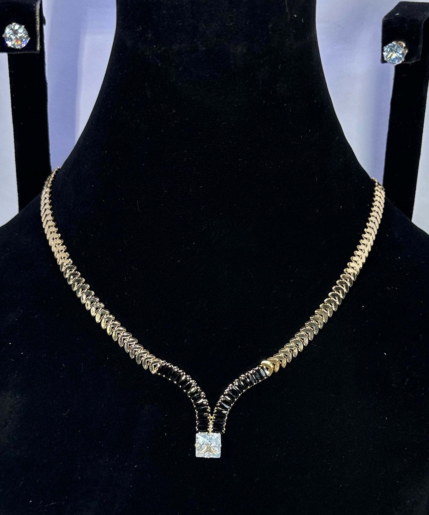 Gold Chain Necklace With A Square Cut Diamond Pendant